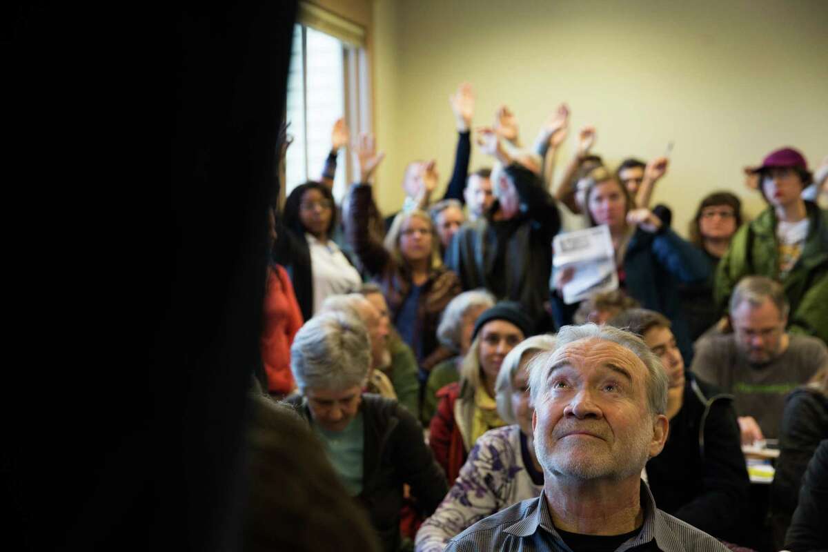 Voters listen to Dana Good talk in support of democratic presidential candidate Berne Sanders during the democratic caucus at Tops K-8 School on Saturday, Mar. 26, 2016.