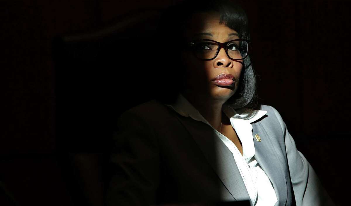Mayor Ivy Taylor listens to public speakers during a City Council meeting at City Hall Chambers on Thursday, December 17, 2015, as sun light from an unshaded window illuminates her.