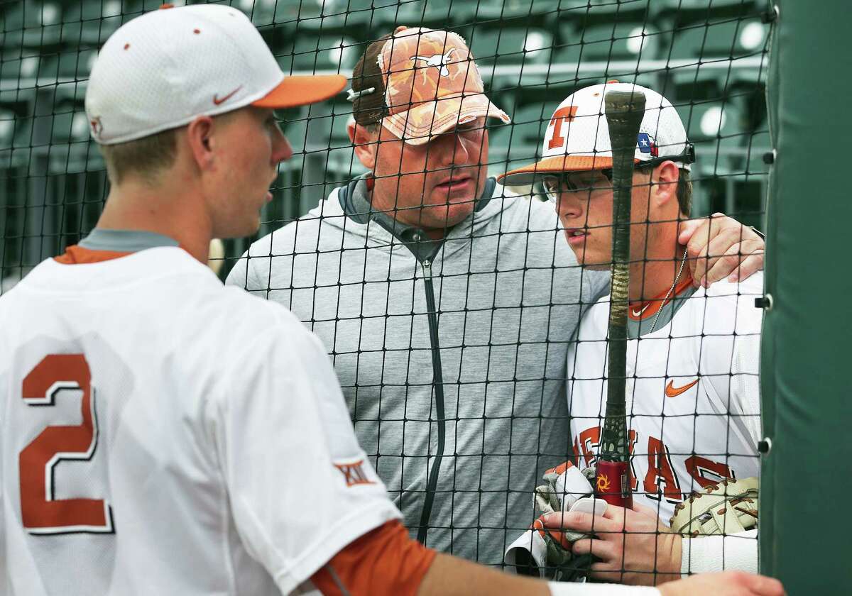 Roger Clemens talks with his sons Kacy (right) and Kody after the game as Texas loses to TCU 9-5 in college baseball at Disch-Falk Field on March 26, 2016.