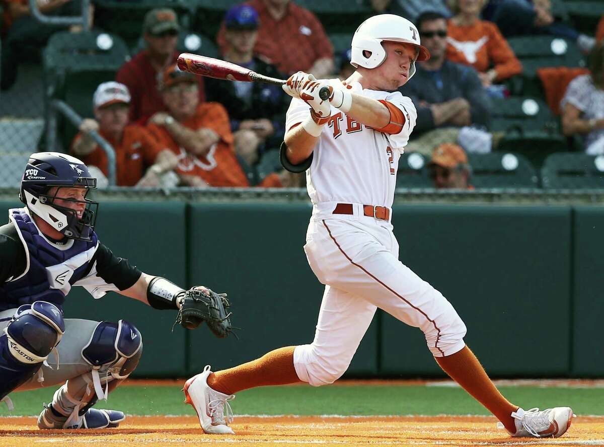 Longhorsn hitter Kody Clemens blasts a hit through as Texas loses to TCU 9-5 in college baseball at Disch-Falk Field in Austin on March 26, 2016.