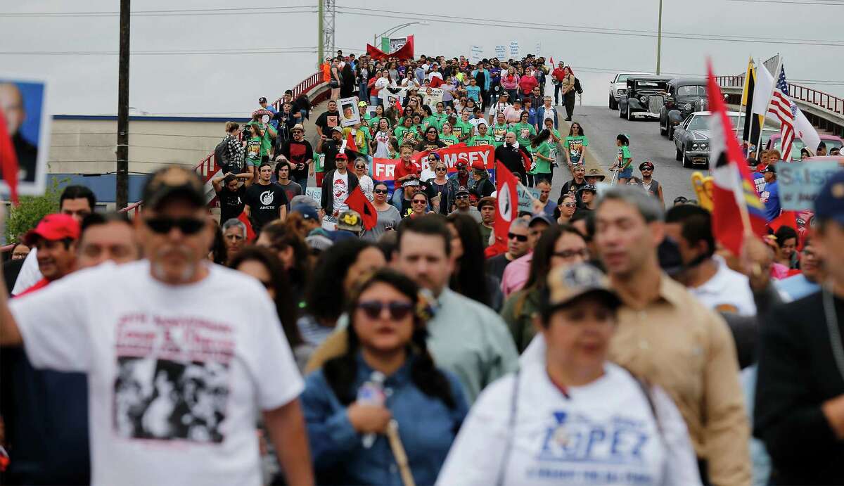Hundreds of participants walk along the Guadalupe Street bridge during the 20th March for Justice by the Cesar E. Chavez Legacy and Educational Foundation on Saturday, Mar. 26, 2016. The participants marched honoring the late labor leader, Chavez, who co-founded the National Farm Workers Association with Dolores Huerta in the 1960s. The foundation was started in 1996 by retired union organizer Jaime Martinez. The foundation has grown to include educational scholarships which awarded $24,000 in 2015. (Kin Man Hui/San Antonio Express-News)