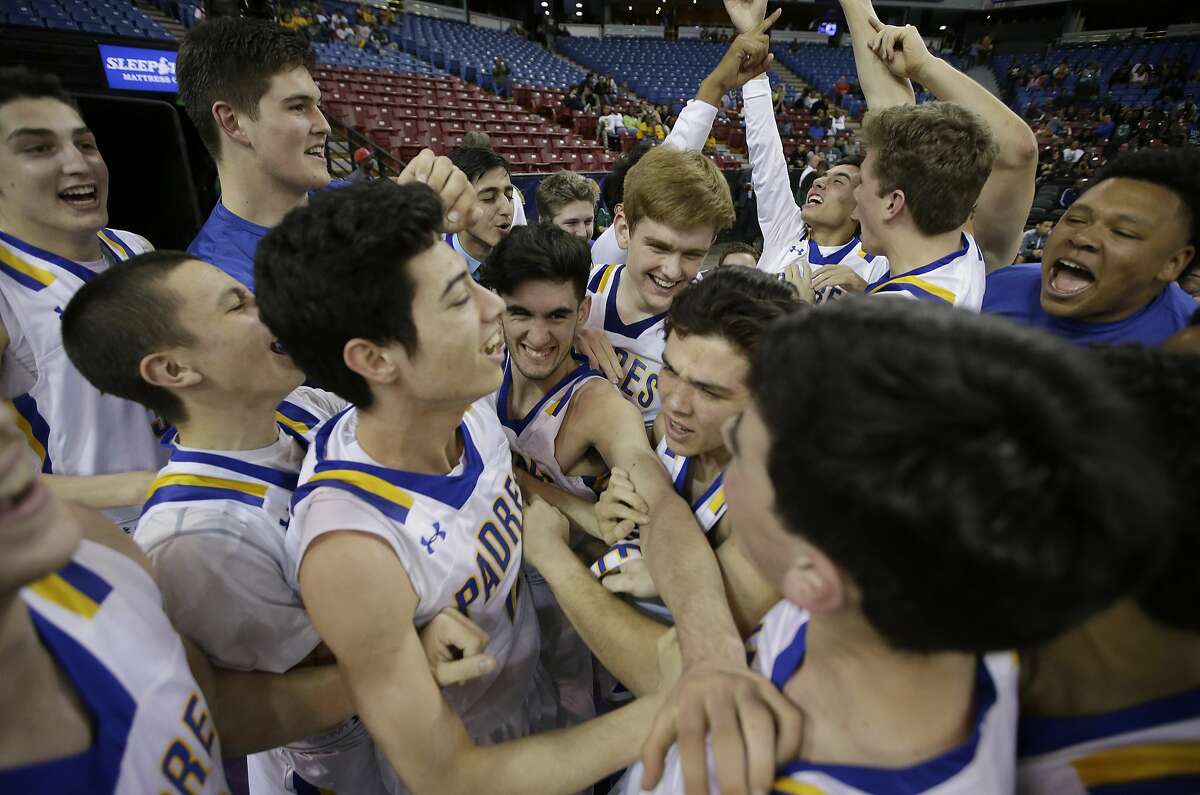 Junipero Serra celebrates after defeating Long Beach Poly 48-43 to win the CIF boys' Division II high school basketball championship game Saturday, March 26, 2016, in Sacramento, Calif. (AP Photo/Rich Pedroncelli)