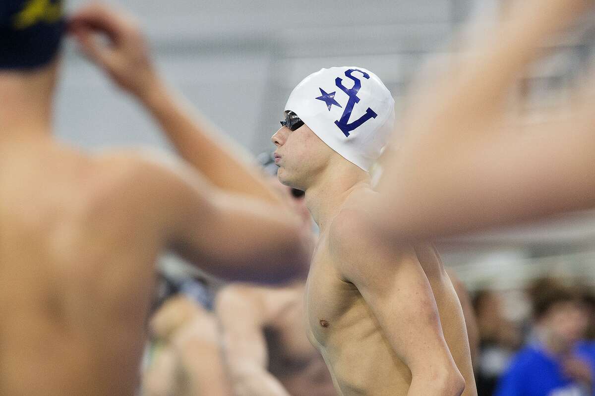 Konnar Klinksiek from CSmithson Valley warms up before swimming in the boys 50-yard freestyle at the 6A UIL state meet at the Jamail Swimming Center in Austin on Feb. 20, 2016.