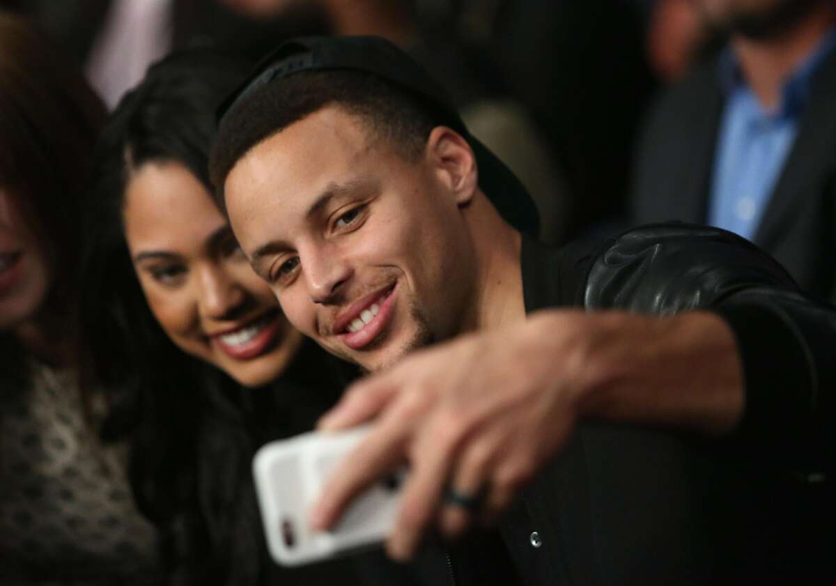 Stephen Curry and Ayesha attend the Andre Ward fight against Sullivan Barrera in their IBF Light Heavyweight bout at ORACLE Arena on March 26, 2016.