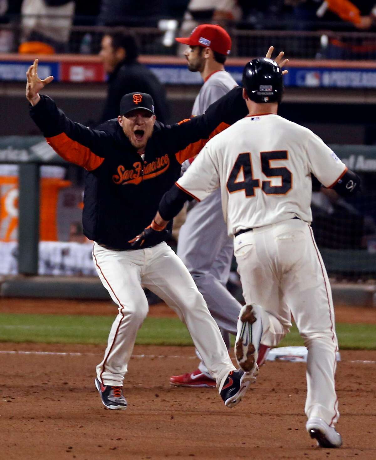 San Francisco Giants Travis Ishikawa watches the flight of his walk off  home run in the ninth inning off St. Louis Cardinals Michael Wacha in game  5 of the National League Championship