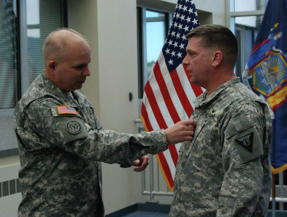 New York Army National Guard Lt. Col. Scott Cleaveland (left) is promoted to Col by Brig. Gen. Raymond Shields, Director of Joint Staff, at New York State Division of Military and Naval Affairs headquarters in Latham, N.Y. on Monday, Feb.22. ( U.S. Army National Guard photo by Eric Durr/released)
