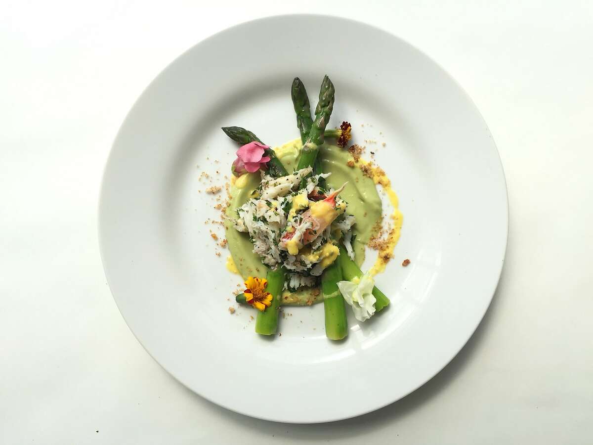 Asparagus with avocado puree, Dungeness crab salad and egg yolk vinaigrette from Pierre Tumlin