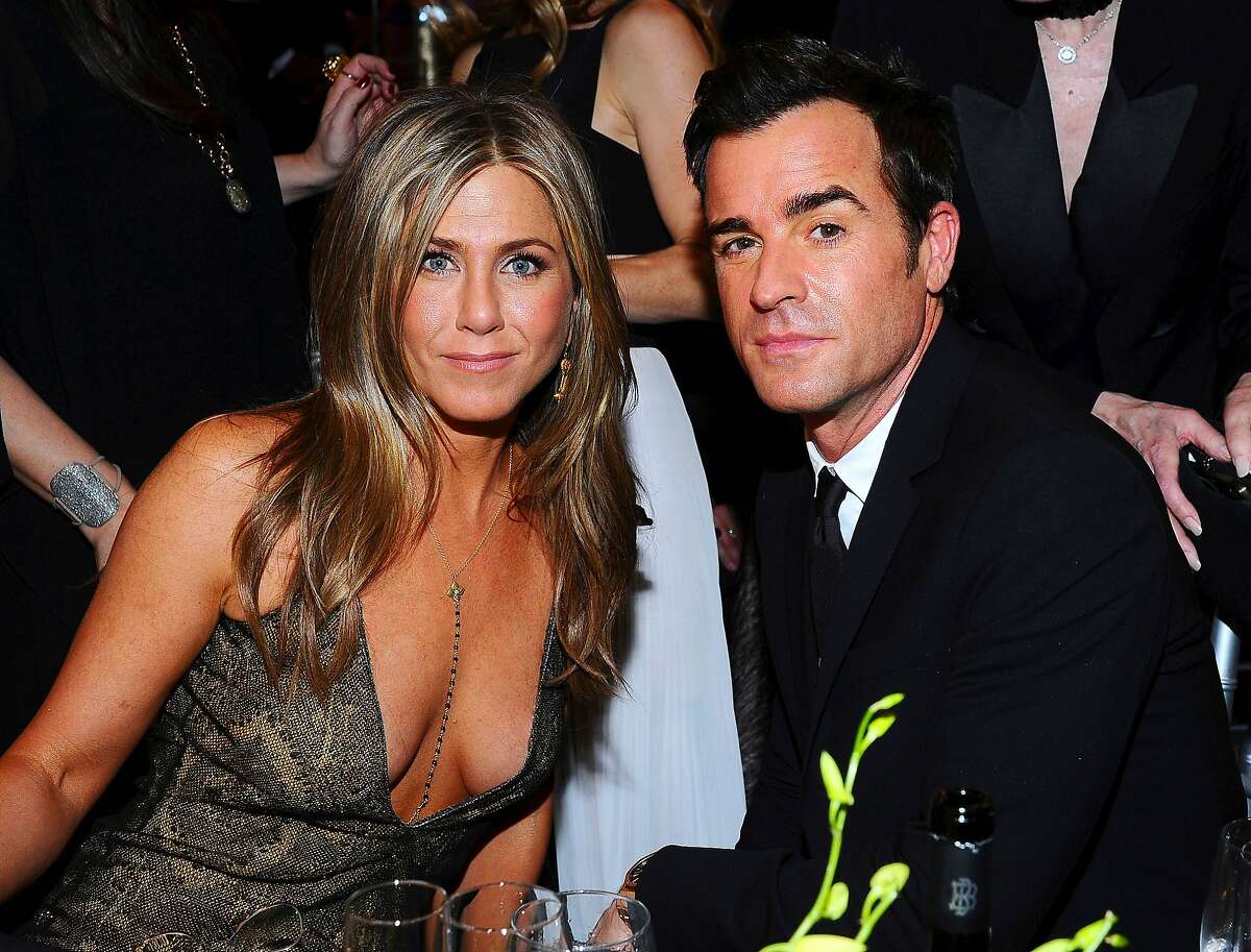 Jennifer Aniston, left, and Justin Theroux pose in the audience at the 21st annual Screen Actors Guild Awards at the Shrine Auditorium on Sunday, Jan. 25, 2015, in Los Angeles. (Photo by Vince Bucci/Invision/AP)