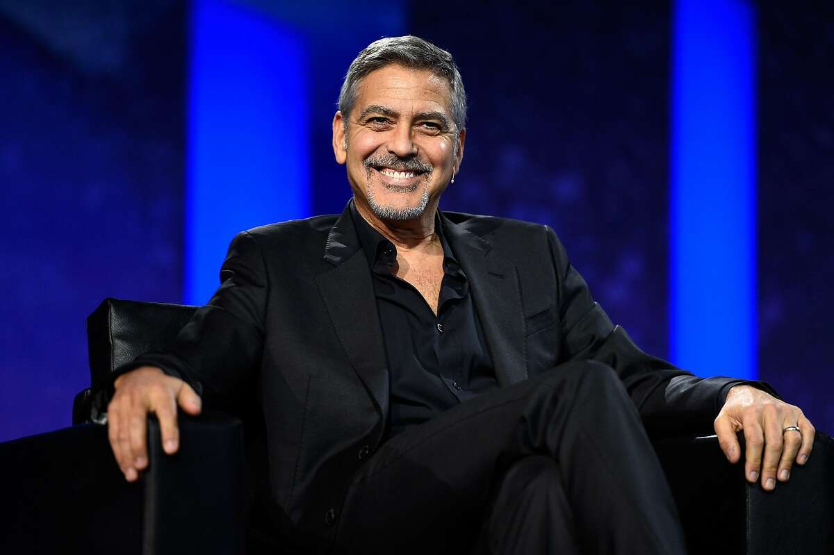 IMAGE DISTRIBUTED FOR ADOBE - George Clooney shares his favorite prank stories onstage at Adobe Summit on Wednesday, March 23, 2016, in Las Vegas. (Jeff Bottari/AP Images for Adobe)