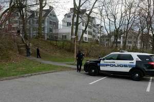 Stamford Police investigate the scene of a shooting near stairs leading from Progress Drive onto the school grounds of  Westover Elementary School  in Stamford on March 25, 2016.