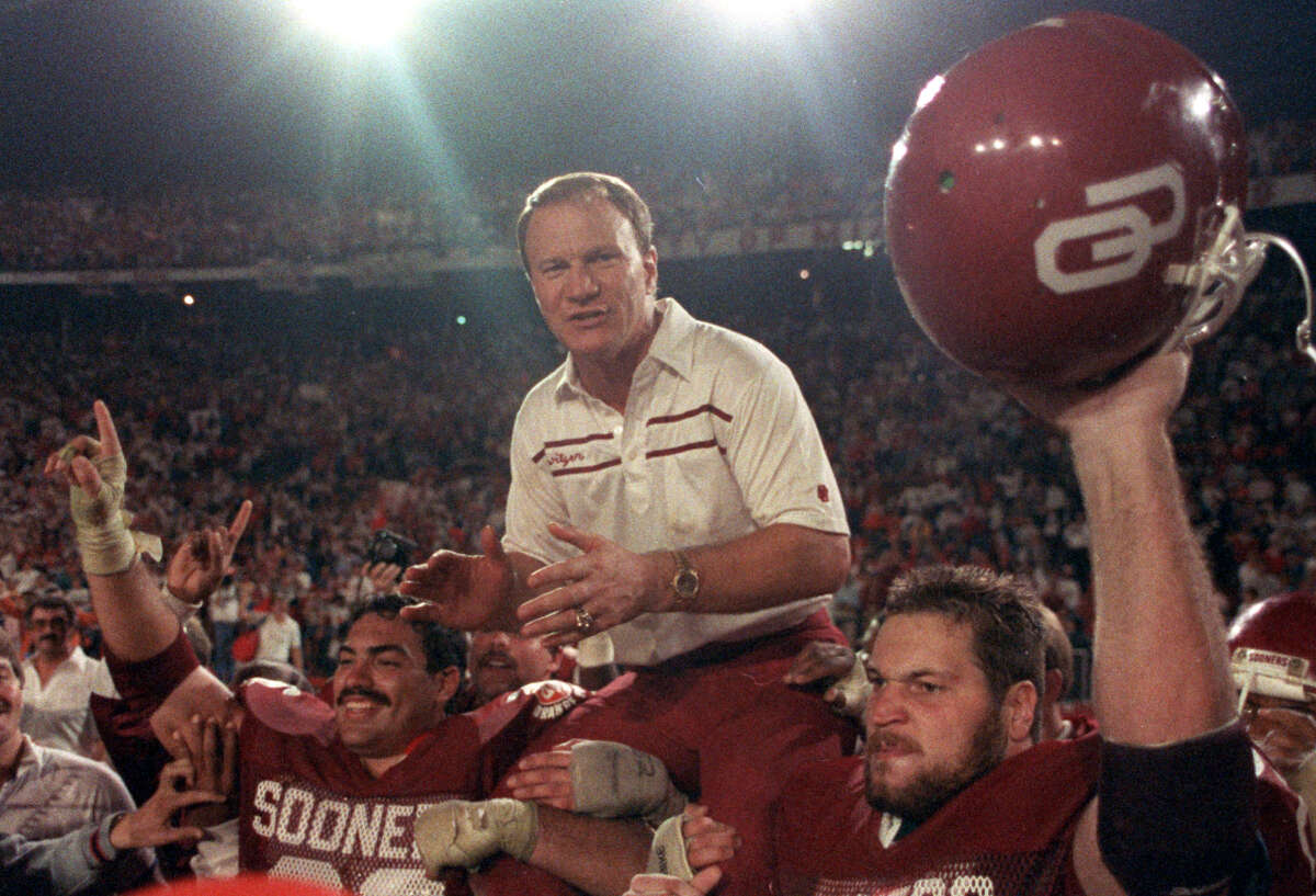 ** FILE ** Oklahoma Sooners coach Barry Switzer gets a ride from jubilant players Tony Casillas, left, and an unidentified player, right, following their win over Penn State in the Orange Bowl in Miami, in this Jan. 2, 1986, file photo. Despite having the fourth-highest winning percentage among major college football coaches, Switzer was passed over five times before being voted in last year. He's among 25 past coaches and players who will be enshrined Saturday, Aug. 9, 2002.