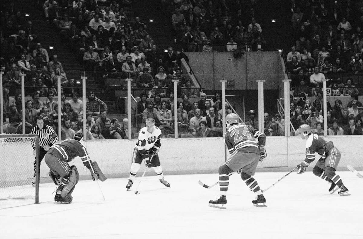 Gordie Howe of the New England Whalers gets set to shoot the puck as Winnipeg Jets goalie Joe Daly sets up during the second period of the Jets-Whalers World Hockey Association game in Hartford on Friday, Nov. 19, 1977. Howe, who needs one goal to score 1,000 career goals, had his shot blocked. Howe had several opportunities to score but was blocked each time. Coming in the Daly�s aid is Larry Hornung of Winnipeg.