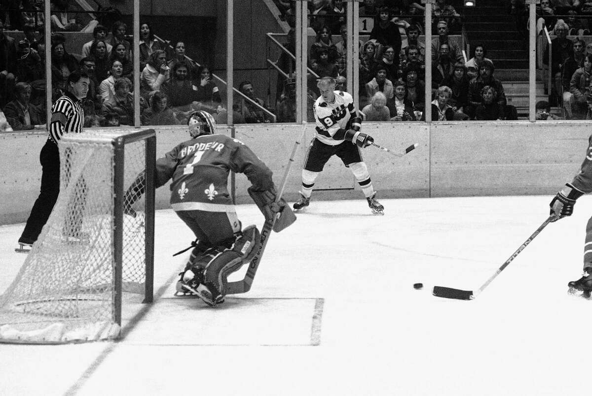 Gordie Howe of the New England Whalers gets set to shoot the puck as Winnipeg Jets goalie Joe Daly sets up during the second period of the Jets-Whalers World Hockey Association game in Hartford, Connecticut, Friday, Nov. 19, 1977. Howe, who needs one goal to score 1,000 career goals had his shot blocked. Howe had several opportunities to score but was blocked each time. Coming in the Daly's aid is Larry Hornung of Winnipeg.