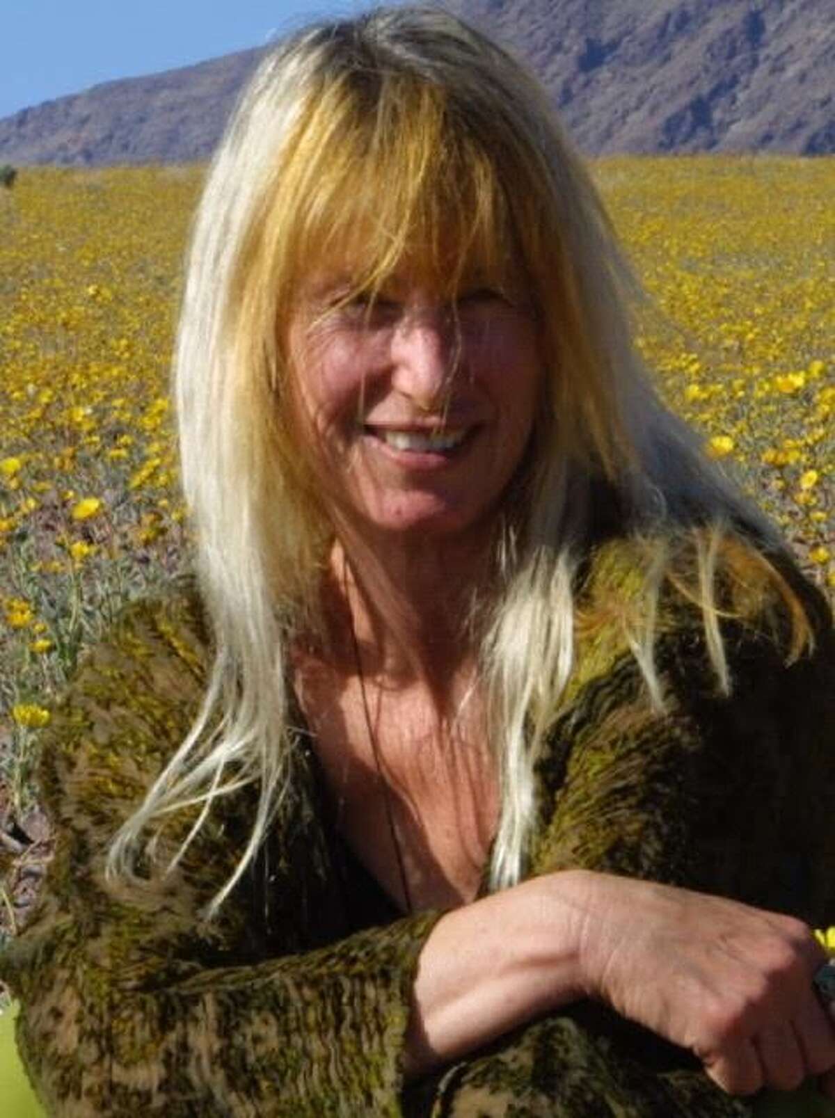 Keeyla Meadows in her favorite place to be among spring wildflowers.