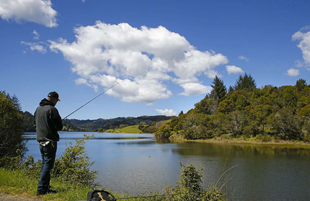 Alex Towery of San Rafael fishes Bon Tempe reservoir in Fairfax, California, on Tues. March 29, 2016. The Marin Municipal Water District is one agency that benefitted from the wet winter.