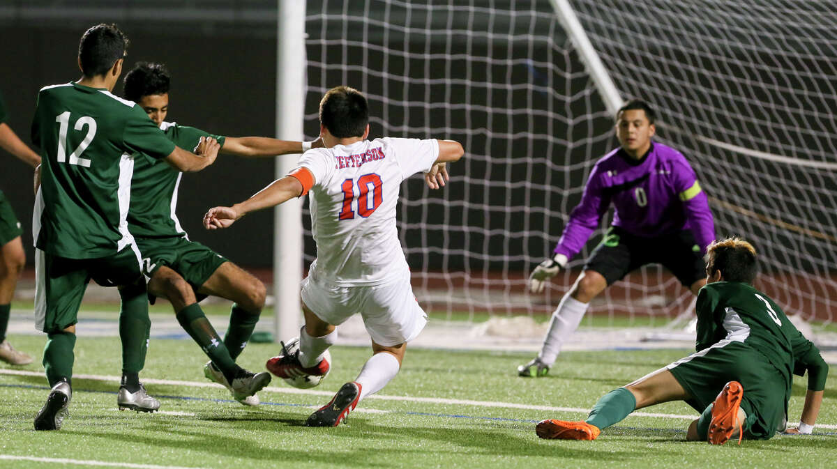 Jefferson's John Mendoza (10) takes a shot at the Kennedy goal during the second half of their Class 5-A Bi-District game at Alamo Stadium on Thursday, March 24, 2016. Mendoza's two goals led Jefferson past Kennedy 4-3. MARVIN PFEIFFER/ mpfeiffer@express-news.net