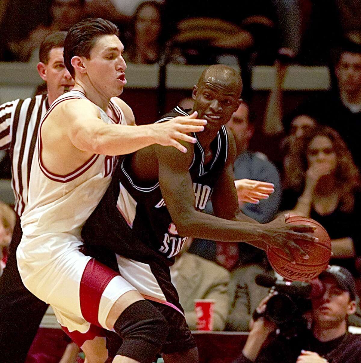 Oklahoma forward Eduardo Najera (21) tries to stop Oklahoma State guard Joe Adkins (35) from moving the ball downcourt during the final two minutes of the Big 12 game in Norman, Oklahoma Saturday, Feb. 12, 2000. Both players scored 21 points in the game, the most of any player. Oklahoma State defeated Oklahoma 74-71.