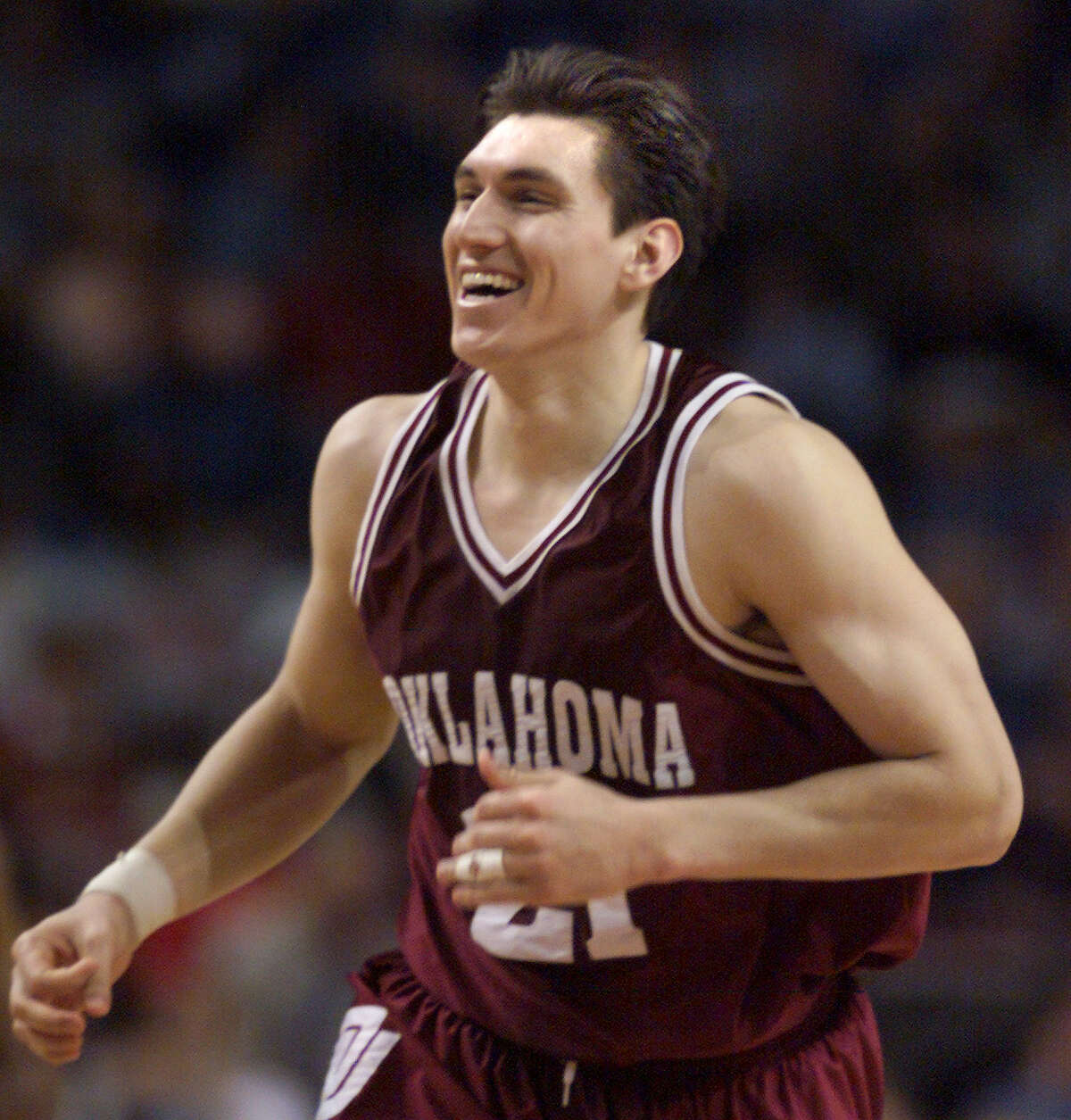 SPORTS - A happy Oklahoma Sooner Eduardo Najera runs down court after scoring two of his 31 points as Oklahoma defeated Texas during their Big 12 Conference men's basketball game in Kansas City, Missouri on Saturday, March 11, 2000. Oklahoma won over Texas 81-65. Kin Man Hui/staff.