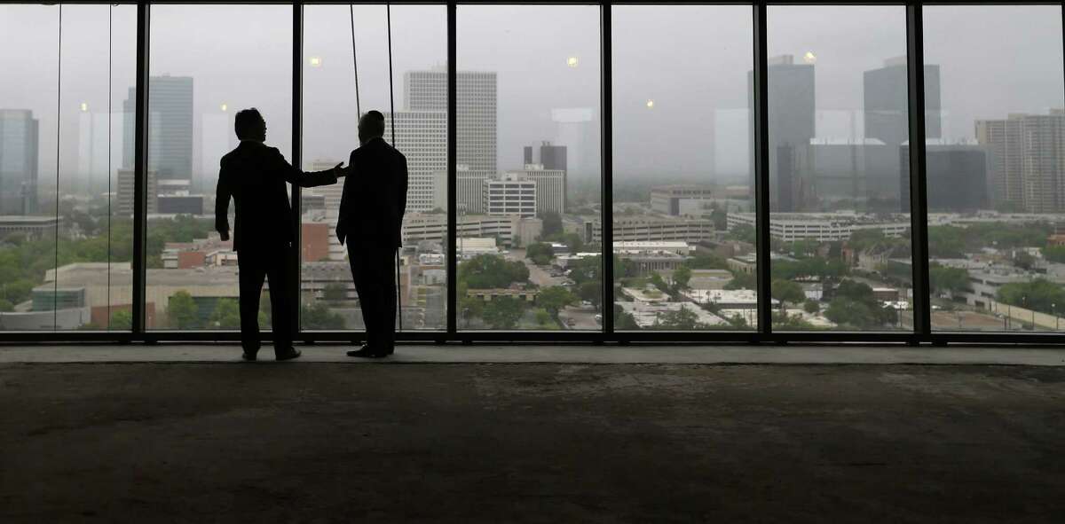 Eric Lagdameo, left, and Gabriel Bousbiv of Arel Capital check out the south view from the 15th floor of the The River Oaks, new development on Westheimer Road on Tuesday, March 29, 2016, in Houston.