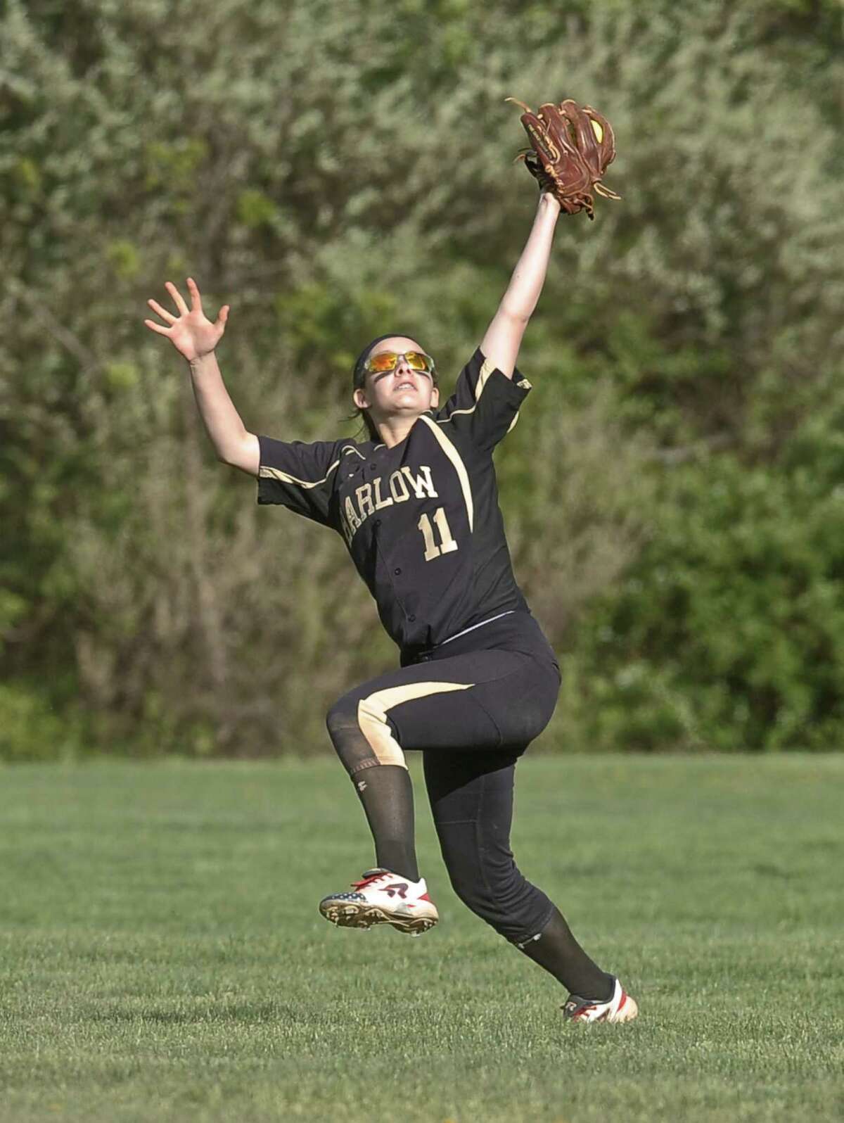 FILE PHOTO: Barlow's Kristen Acocella (11) makes a catch in the outfield for the final out of the girls high school softball game between Joel Barlow and Pomperaug high schools on Wednesday, May 13, 2015, played at Pomperaug High School, in Southbury, Conn.