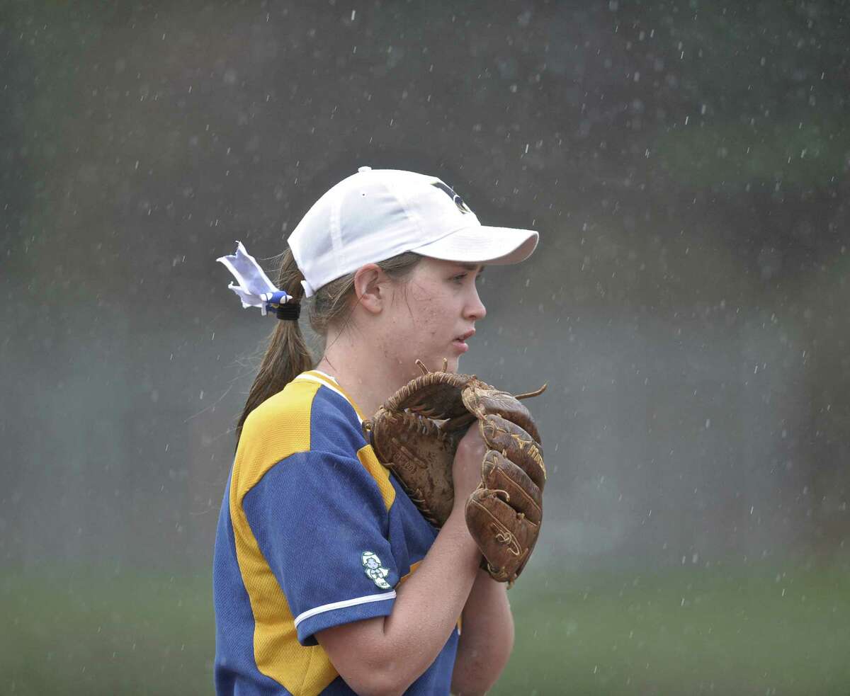 FILE PHOTO: Newtown's Katie Laaksonen (2) watches the batter from third as the rain starts to fall during the girls high school softball game between Joel Barlow (Redding) and Newtown high schools, played at Newtown High School, on Wednesday, April22, 2015, in Newtown, Conn.