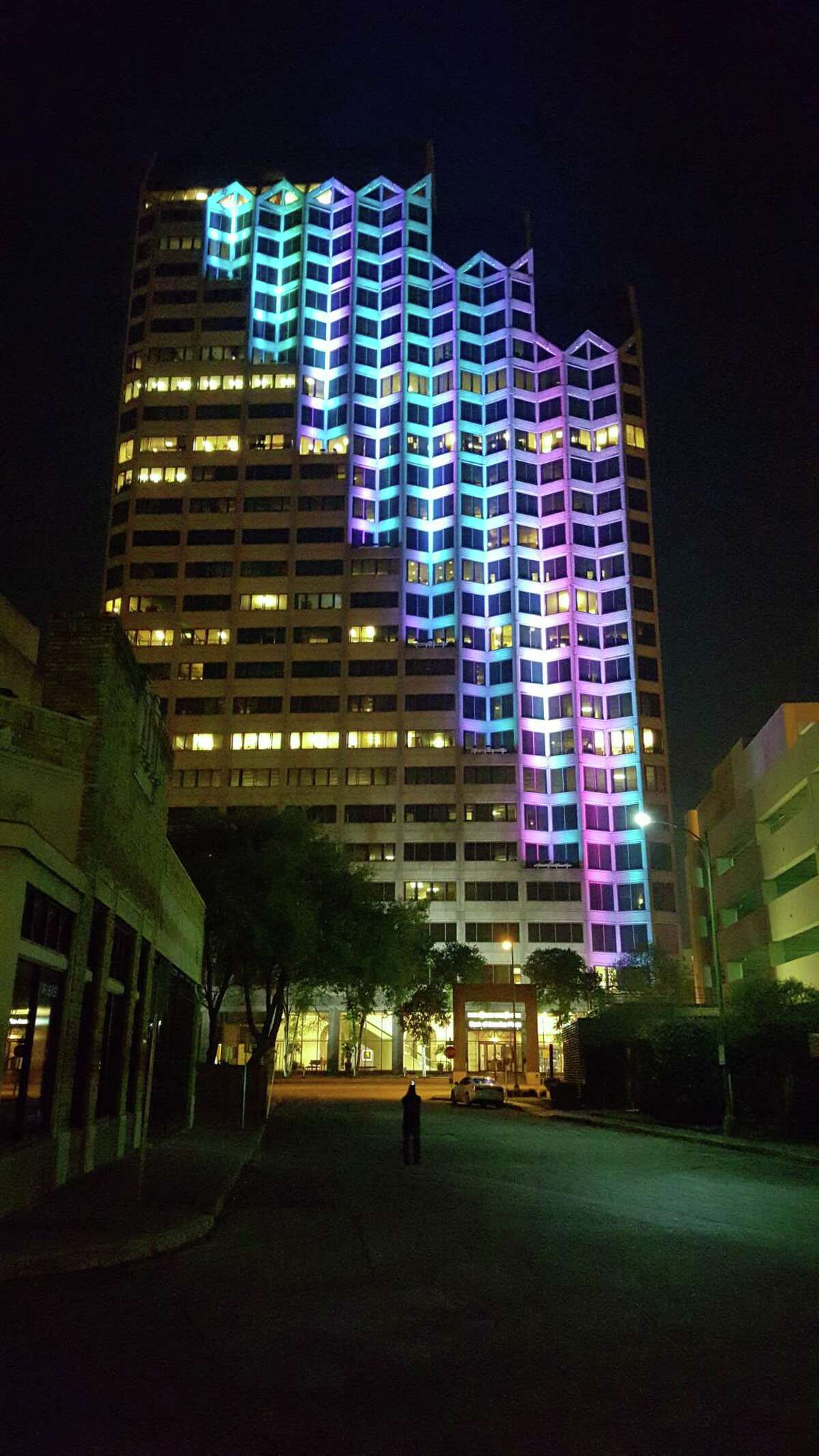 OCI Solar Power LLC has filed a lawsuit to to maintain its headquarters in the building at 300 Convent St. in downtown San Antonio. Pictured is a test lighting of “Kinetic Skyline,” a light installation by Bill FitzGibbons, at the building in 2016.