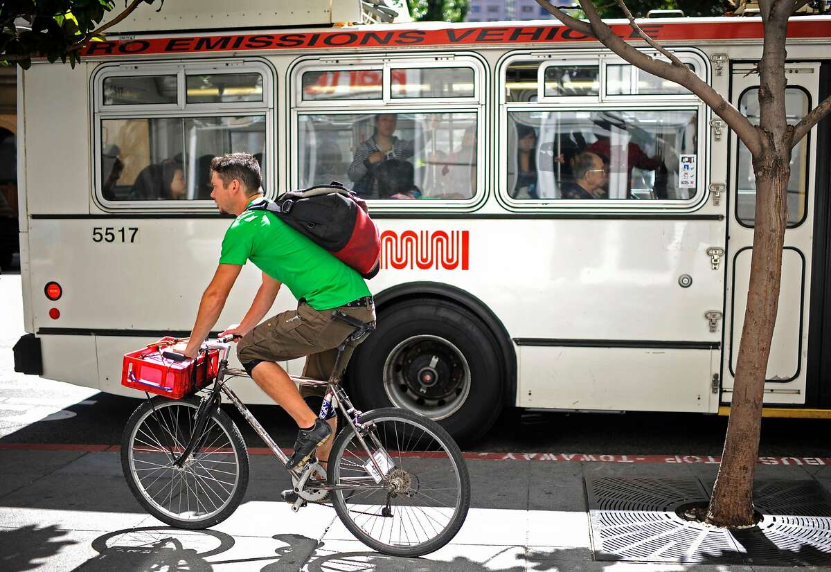 Jeff Dunst, a deliveryman for Postmates, delivers donuts to his clients on Tuesday, Aug 7, 2012 in San Francisco.