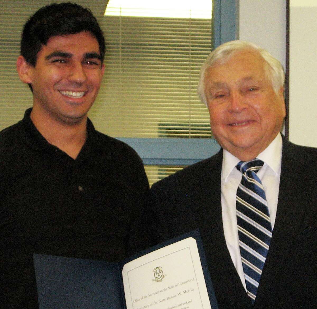 Jaime Bairaktaris, left, a Staples High School senior, with Superintendent of Schools Elliott Landon, has received a Certificate of Recognition from the Secretary of the State and the Connecticut Citizenship Fund.