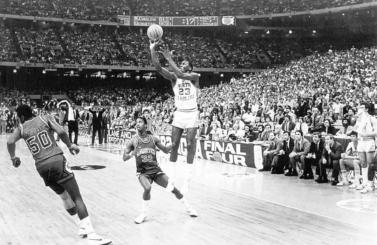 FILE - Michael Jordan fires the game-winning shot in the final seconds against Georgetown in the championship game of the NCAA tournament in New Orleans on March 29, 1982. Jordan has made nearly 30 game-winning shots in his pro career, including one that gave the Chicago Bulls their sixth NBA championship. But none was bigger than the one he hit 20 years ago Friday. (AP Photo/The News & Observer, Allen Dean Steele)