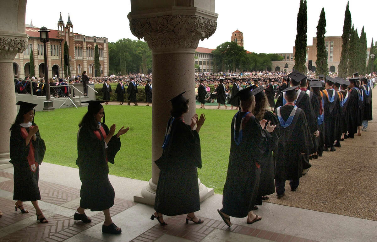 Students clap for themselves as they take the long walk to the stage to receive their diplomas at Rice University's graduation. Keep clicking to see how Texas schools stacked up on the latest US News and World Report college rankings. 