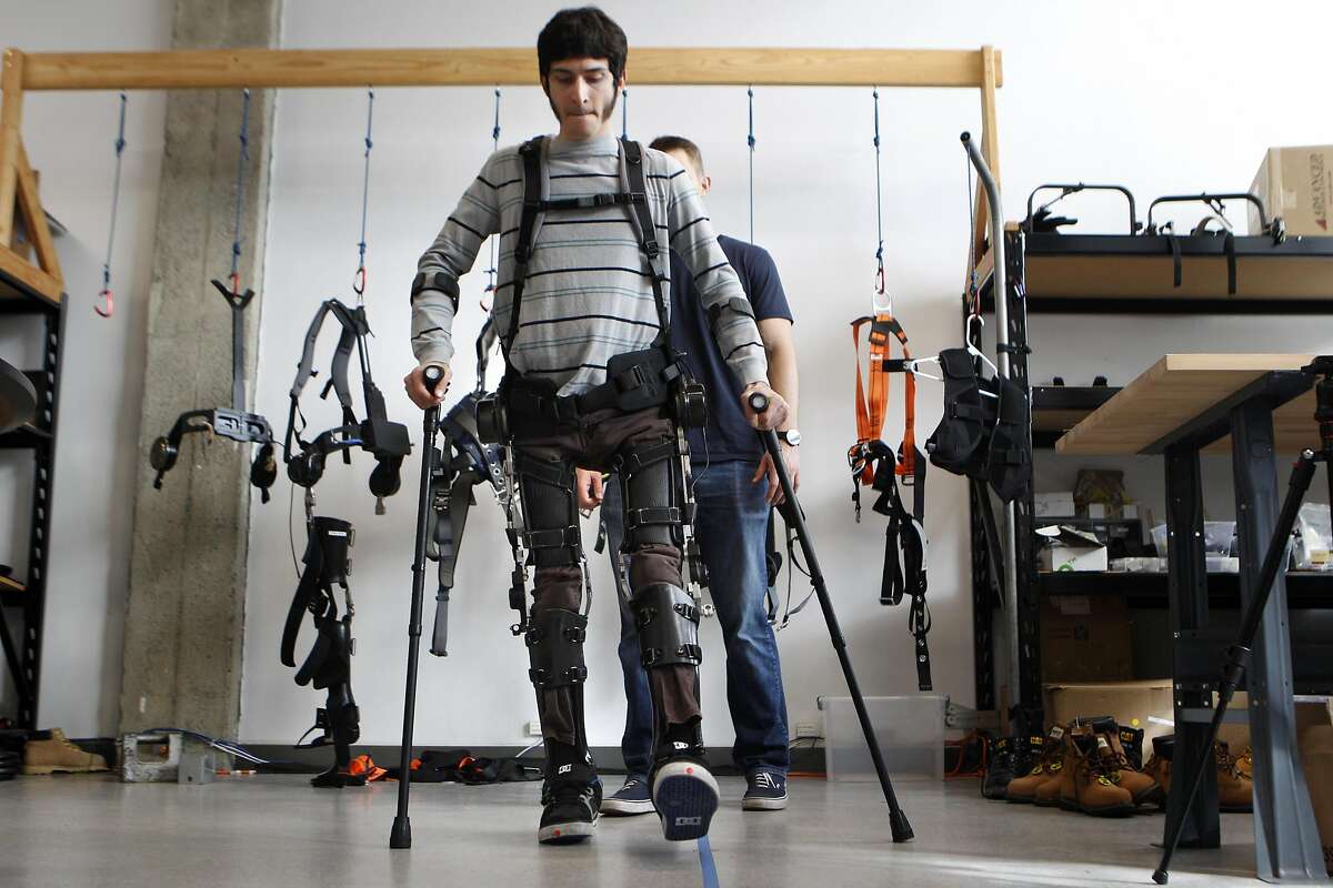 Steve Sanchez, who was paralyzed from the waist down in a BMX accident, test walks the latest robotics suit from SuitX, the Phoenix device, at their offices in Berkeley, Calif., on Thursday March 31, 2016. This suit allows people who have been paralyzed, or have limited mobility, to walk again. This latest suit technology is considered to be the lightest and cheapest at $40,000.