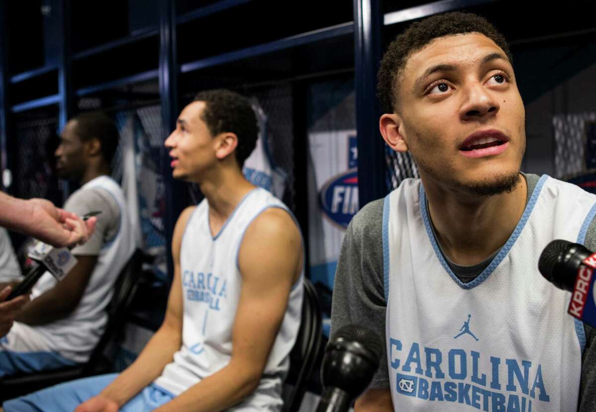 North Carolina forward Justin Jackson speaks to reporters in the locker room following practice for the NCAA national semifinal at NRG Stadium on Thursday, March 31, 2016, in Houston.