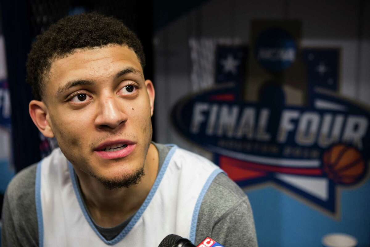 North Carolina forward Justin Jackson speaks to reporters in the locker room following practice for the NCAA national semifinal at NRG Stadium on Thursday, March 31, 2016, in Houston.