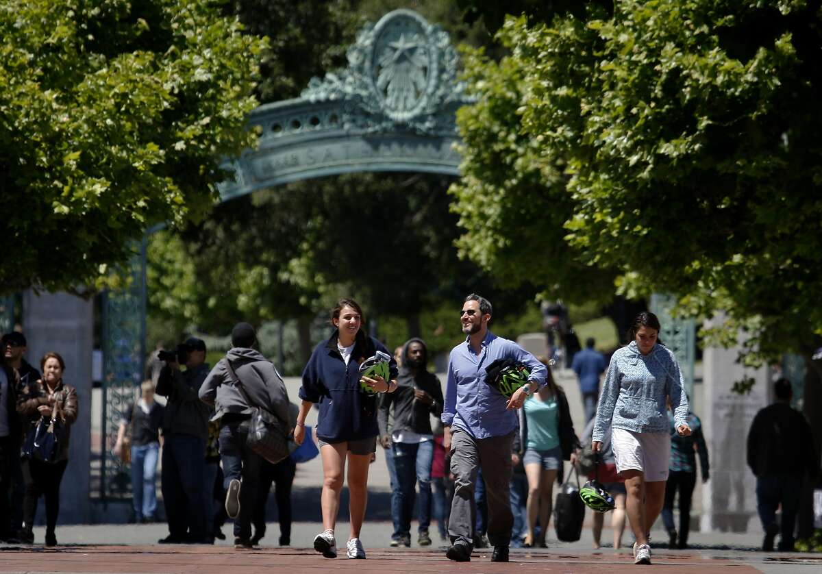People stroll through Sproul Plaza in front of Sather Gate on the Cal campus in Berkeley.
