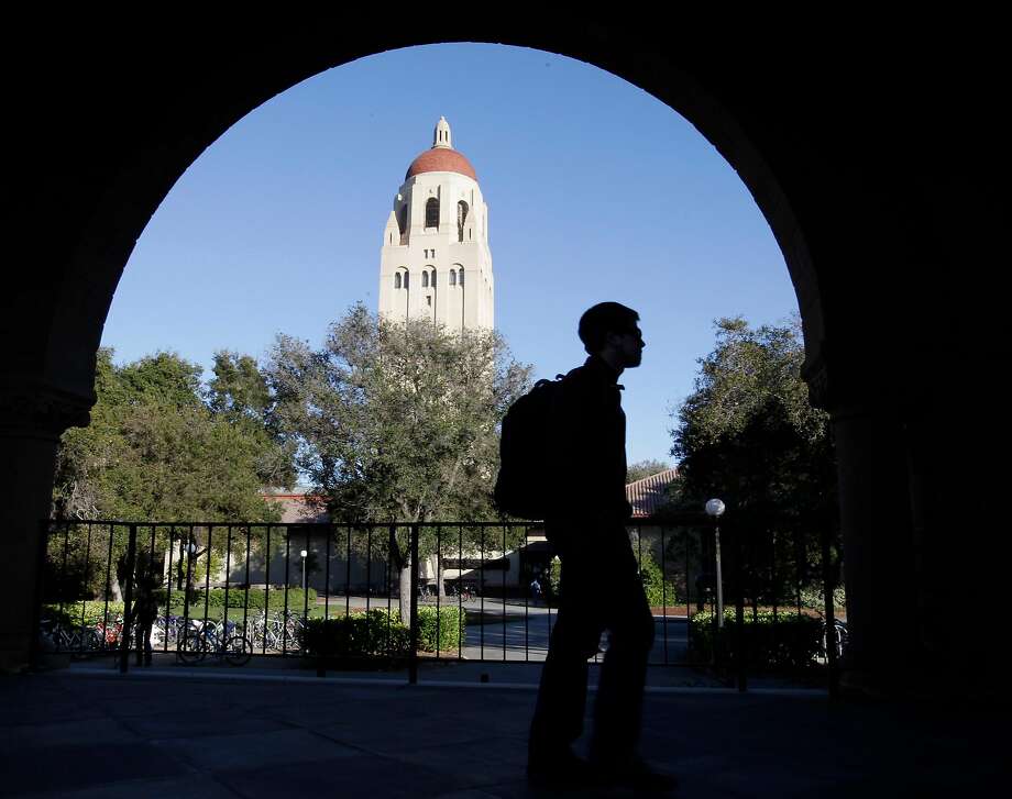 In this archive photo from February 15, 2012, a student from Stanford University walks past the Hoover Tower on the campus of Stanford University in Palo Alto, California. Photo: Paul Sakuma, Associated Press