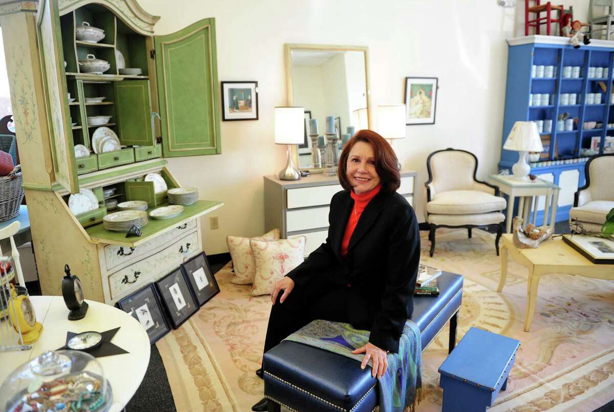 Kate Allen, owner of Blue Egg Home, poses at her shop along Boston Post Road in Milford, Conn., on Tuesday Mar. 22, 2016. Allen relocated from Bridgeport to the new location recently, and offers a selection of handmade jewelry, furniture and artwork from several local artisans. Allen also offers workshops a couple of times a month to teach furniture painting, which is her specialty.