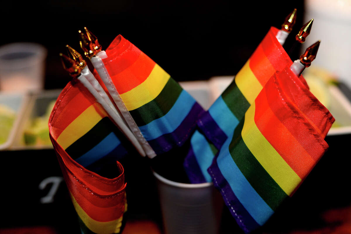 Pride flags decorate the bar during the Pride launch party at the Red Room on Crockett Street on Thursday night. Photo taken Thursday 3/31/16 Ryan Pelham/The Enterprise