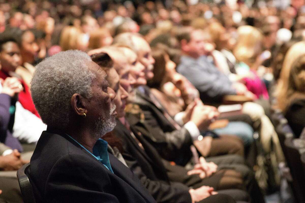 Morgan Freeman sits with exuberant worshipers in Joel Osteen's megachurch in Houston in episode three of  'The Story of God' on National Geographic Channel.