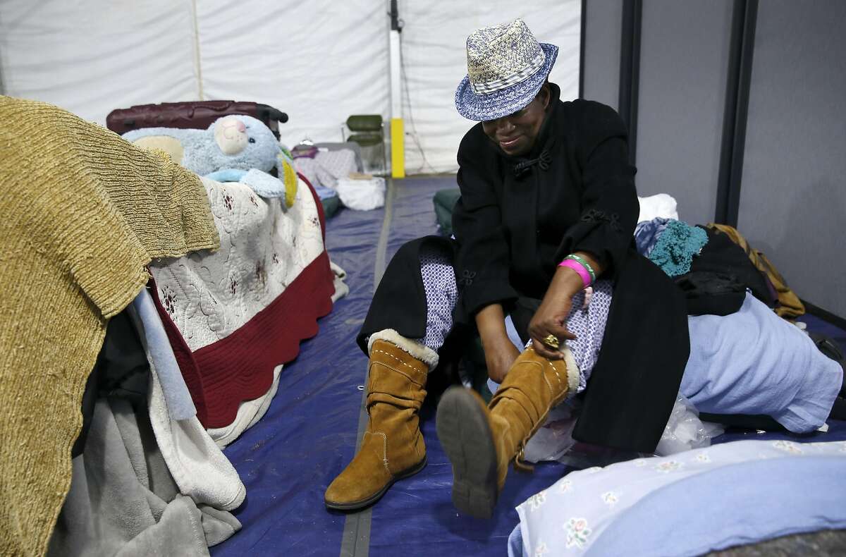 Miss Trotter prepares for to head out for the day inside the shelter on Pier 80 in San Francisco, Calif. on Friday, April 1, 2016.