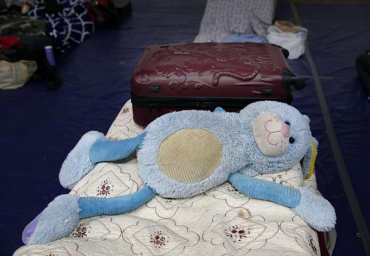 A guest's belongings are left on her bed while she's away from the Pier 80 homeless shelter in San Francisco, Calif. on Friday, April 1, 2016.