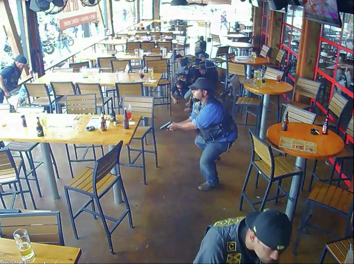 In this image made from surveillance video, members of a motorcycle club react to a shooting at a Twin Peaks restaurant in Waco, Texas on May 17, 2015. On Friday, Oct. 30, 2015, The Associated Press published surveillance video and photos of the Twin Peaks restaurant where the deadly shooting occurred. The release comes nearly six weeks after AP reviewed more than 8,800 pages of evidence related to the confrontation. (AP Photo)