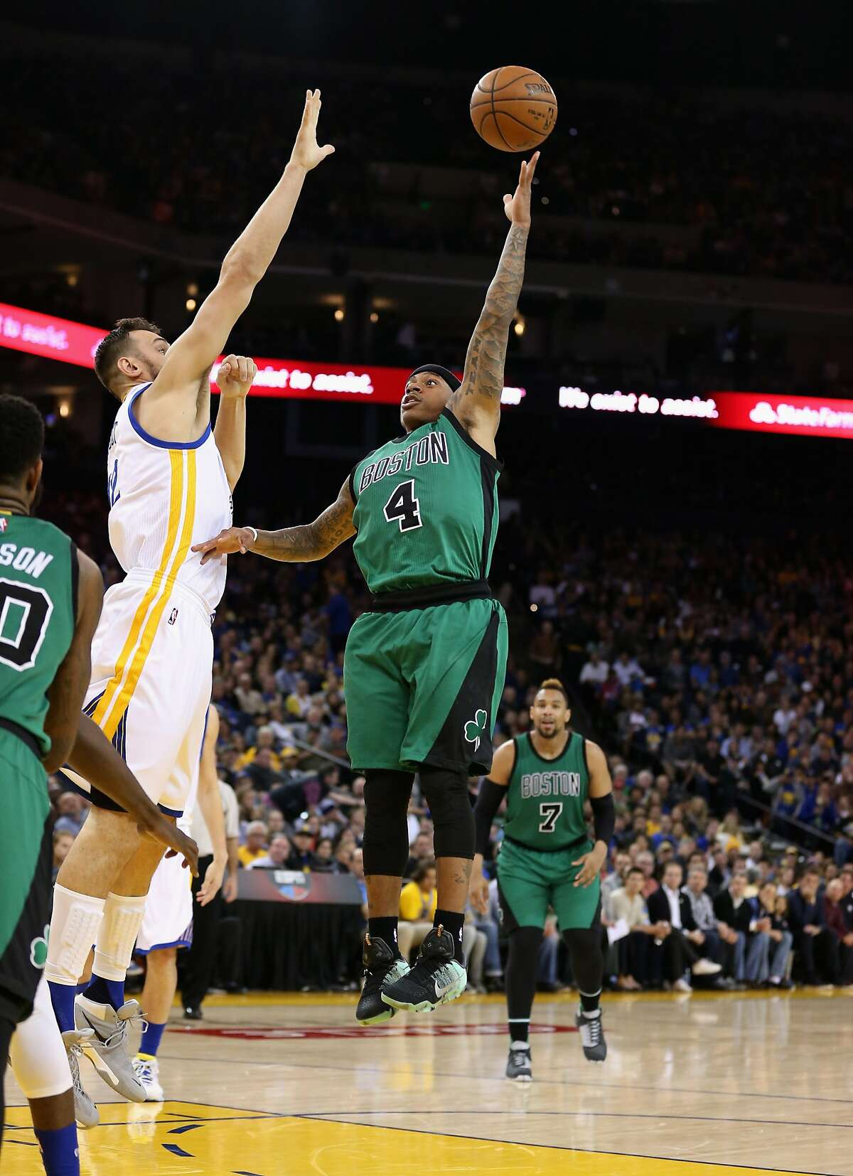 OAKLAND, CA - APRIL 01: Isaiah Thomas #4 of the Boston Celtics shoots over Andrew Bogut at ORACLE Arena on April 1, 2016 in Oakland, California. NOTE TO USER: User expressly acknowledges and agrees that, by downloading and or using this photograph, User is consenting to the terms and conditions of the Getty Images License Agreement. (Photo by Ezra Shaw/Getty Images)