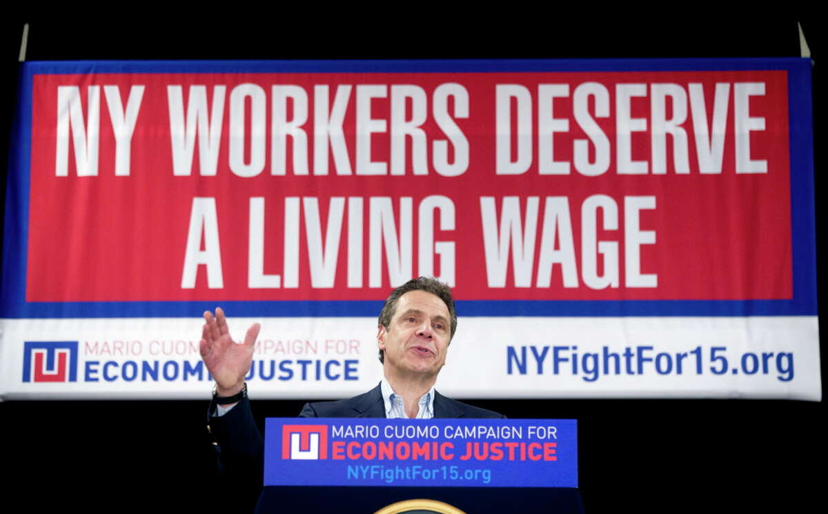 FILE--In this Feb. 25, 2016 file photo, New York Gov. Andrew Cuomo speaks during a rally to raise the minimum wage in Albany, N.Y. The biggest proposals of the year in Albany - a $15 minimum wage, paid family leave, higher taxes on millionaires, ethics reforms and a big jump in school spending _ will live or die this week as lawmakers piece together next year's state budget. (AP Photo/Mike Groll, File) ORG XMIT: NYMG305