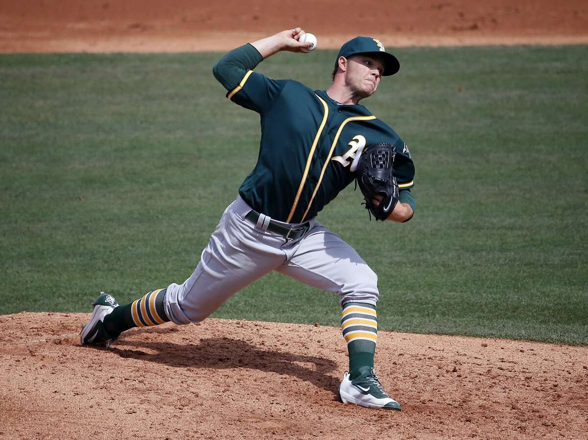 Oakland A's pitcher Sonny Gray throws during the third inning of a spring training baseball game against the against the Chicago Cubs, Tuesday, March 29, 2016, in Mesa, Ariz. (AP Photo/Matt York)