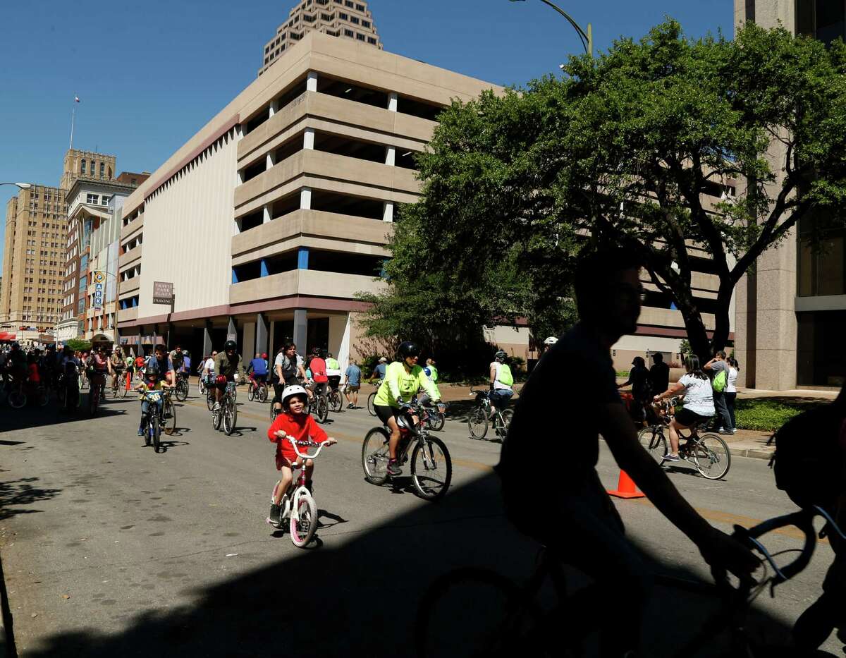 Riders ride down Travis St. during the 10th s?’colov?’a in downtown San Antonio. This free event turns city streets into a safe place for people to exercise and play when they become car-free from 11 a.m. to 3 p.m on Sunday,April 3, 2016.