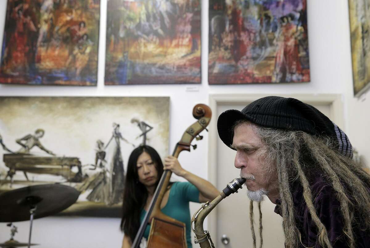 Caroline Chung, left, and David Byrd, right, play during a jazz jam session at Noise in San Francisco, Calif., on Sunday, April 3, 2016. Daniel Brown, 27, and his mother, Sara Johnson , 59 have opened a storefront record store and art gallery. Dan is a professional sax player and on Sunday afternoon from 3 to 6 he holds a jam session in the back of the store. Professional jazz players come from all over to play while people sit and listen and others browse through racks of classic rock and jazz vinyl.