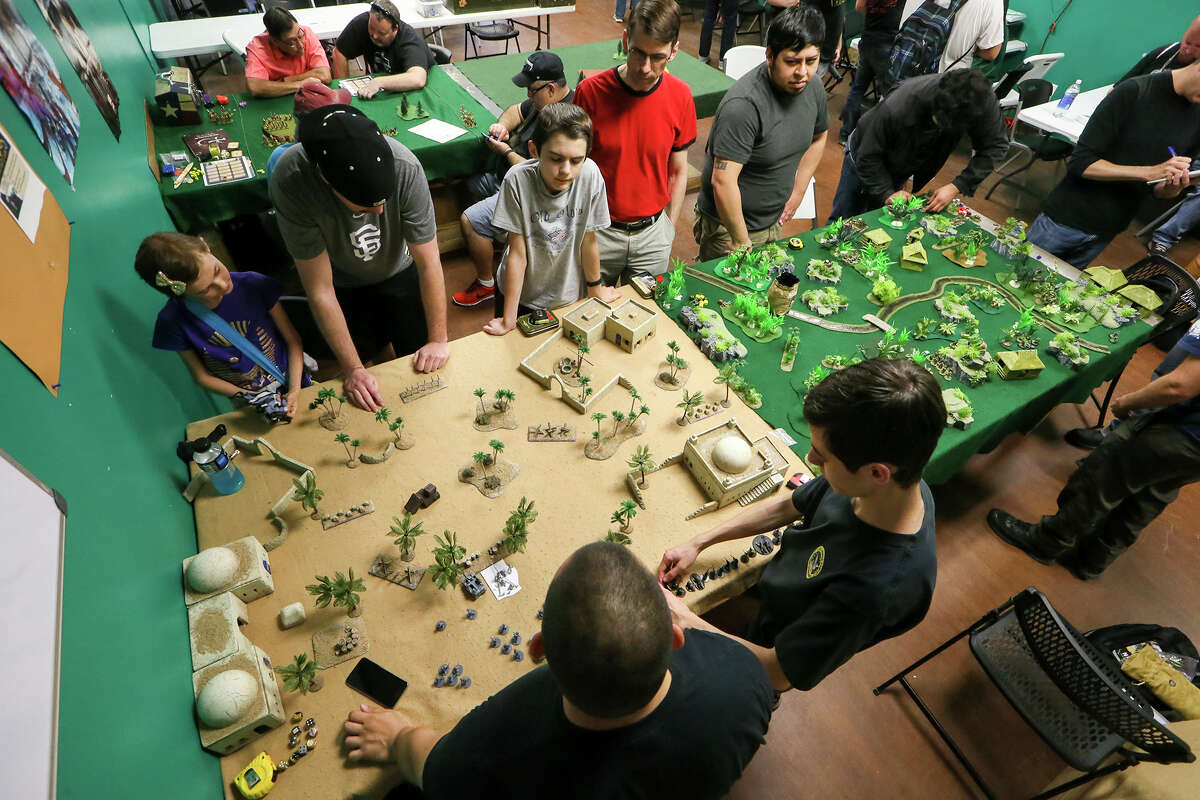 Members of the Lone Star Historical Minatures group set up World War II war games in the North African theater (left) and Pacific theater (right) with historically accurate miniature troops and soldiers at Dragon's Lair Comics & Fantasy, 7959 Fredericksburg Rd., on Friday, March 18, 2016. MARVIN PFEIFFER/ mpfeiffer@express-news.net