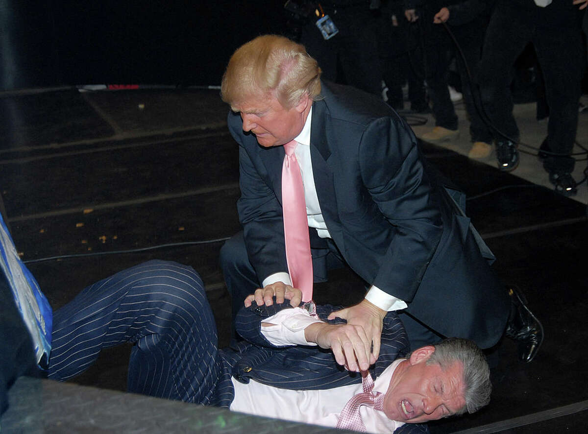 Donald Trump attacks Vince McMahon during the "Battle of the Billionaires" at WrestleMania 23 at Ford Field in Detroit front of 80,103 fans.