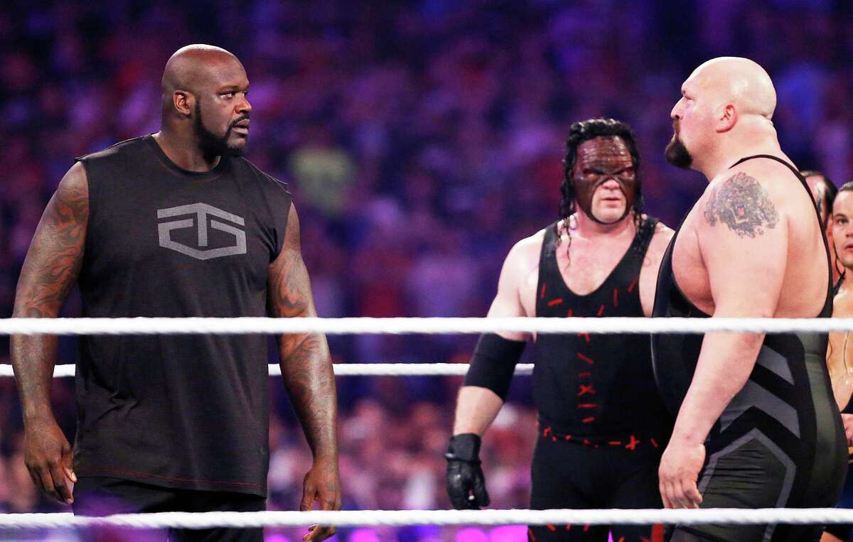 IMAGE DISTRIBUTED FOR WWE - NBA legend Shaquille O'Neal, left, faces off with WWE superstar The Big Show at WWE WrestleMania 32 at AT&T Stadium on Sunday, April 3, 2016, in Arlington, Texas.