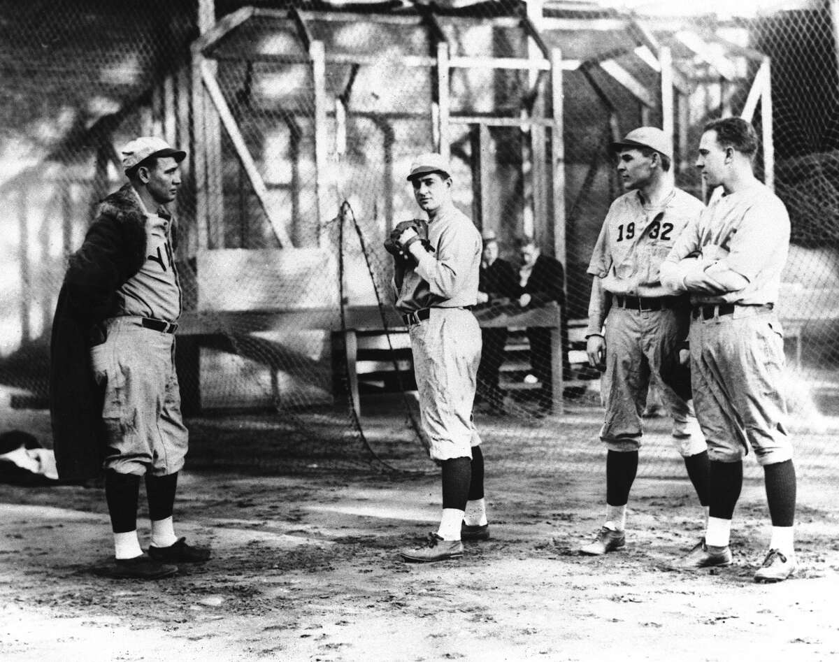 Yale ball players warm up in the cage, preparing for the spring training grind at New Haven, Conn., Feb. 12, 1930. From left to right are: “Smoky” Joe Wood, coaching William Newton, of New Haven, Conn., in the pitcher’s art, while Wendell Thompson of Fall River, Mass., and Ogden Miller of Plantsville, Conn., look on. (AP Photo)